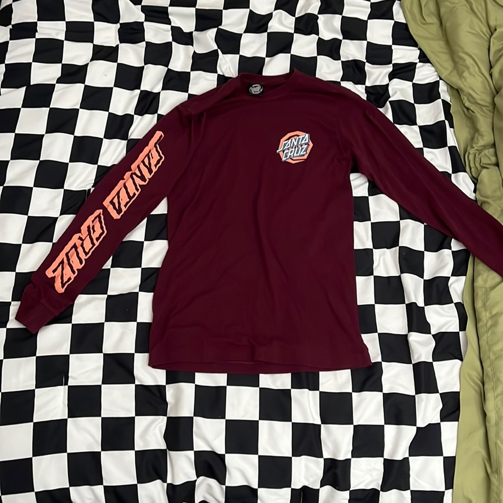 This is a maroon Santa Cruz long sleeve T-shirt it is a size small